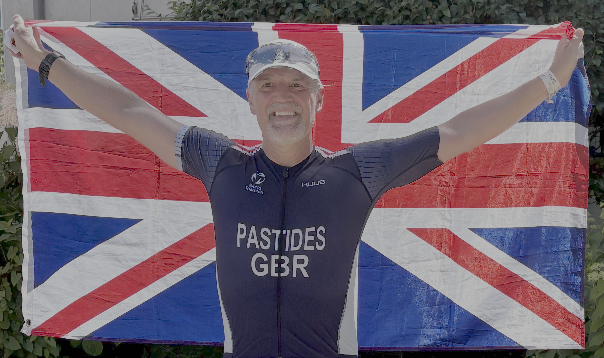 Pete Pastides celebrating with Union Jack flag